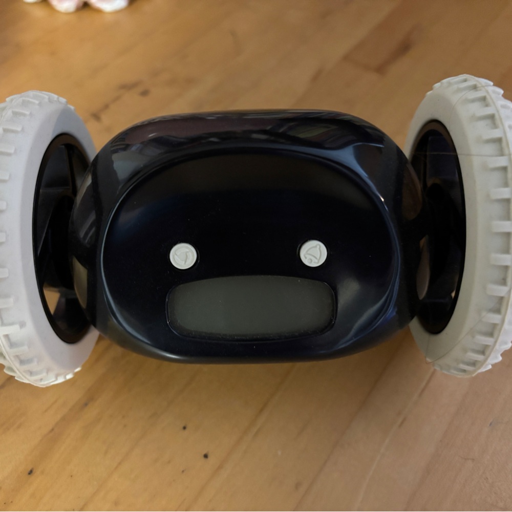 Clocky rolling alarm clock